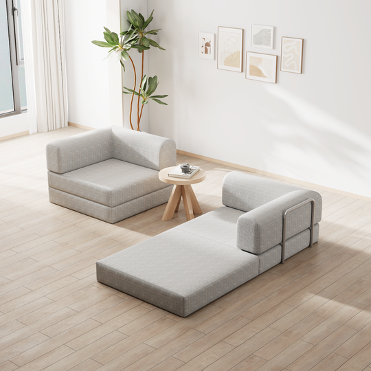 Modular gray fabric sectional sofa with ottoman in minimalist living room with wooden flooring