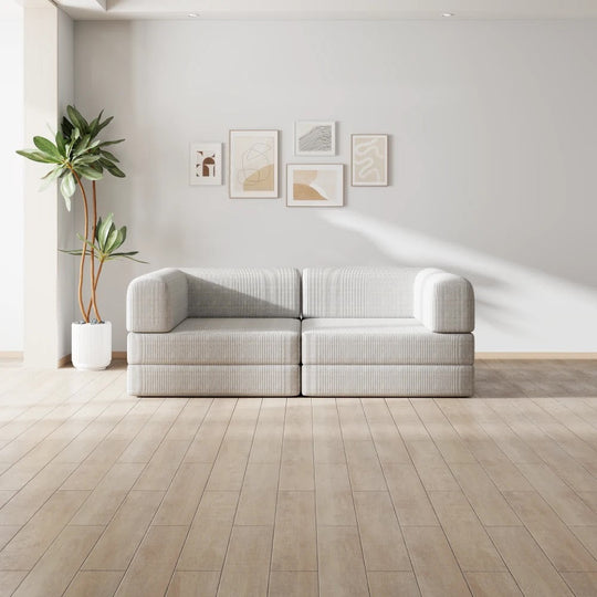 White corduroy Momomi modular sofa in a bright, minimalist family living room